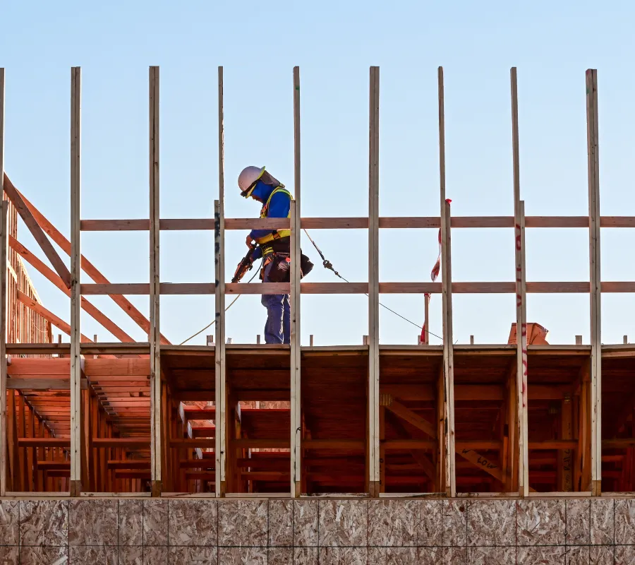 Commercial framing project in Dallas showing multi-story wood framing under construction
