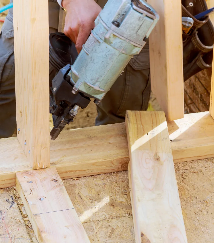 Residential framing contractor installing wood framing for a new home construction project in Dallas, Texas